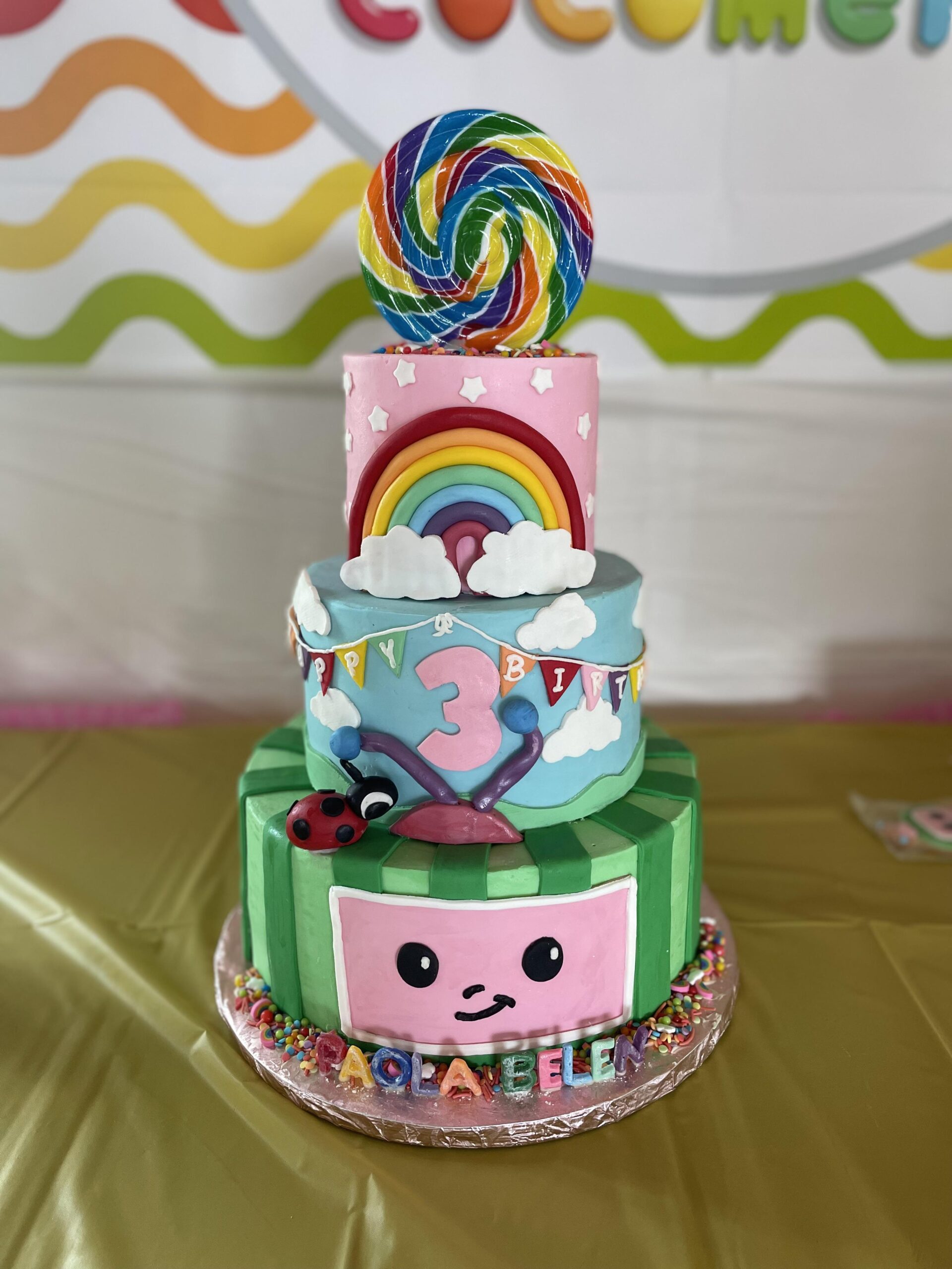 Rainbow Lollipop CoComelon Cake